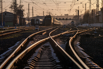 Railway idyll - the intricacies of rails in the rays of the setting sun