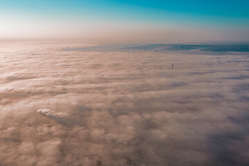 Clouds surrounding a city at the morning. Smog. Smoke. Fog. Weather. Hazardous. Air pollution. Above