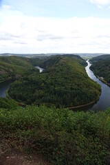 World famous Saarschleife (Great bend of River Saar) seen from above on a cloudy autumn day,...