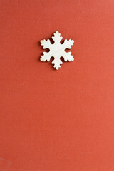 christmas themed background with isolated snowflake made of wood