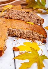 Semolina cake or manna pie with walnuts and raisins on wooden rustic table. Close up