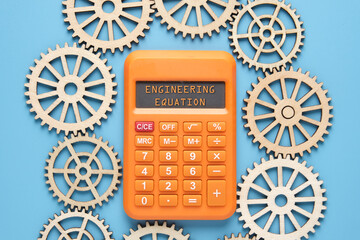 Calculator with the word written engineering equation and gears.