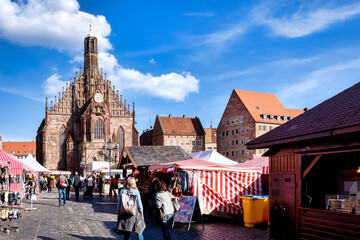 Nuremberg, Marketplace with cathedral and market stalls on a sunny day in Autumn