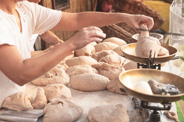 Fototapeta premium young woman kneading flour, ready to cook