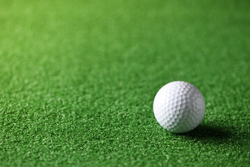 Close-up golf ball on green