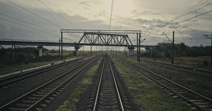 Cinematic shot: Train journey point of view from driver's view. Railway Track Seen from Train Perspective POV. Shaking from motion. 4k