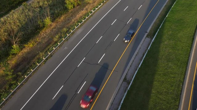 Evening commute with traffic on the Don Valley Parkway. Sunny with long shadows. Toronto.