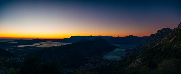 Orange streak of light above the horizon. Bay of Kotor, Montenegro