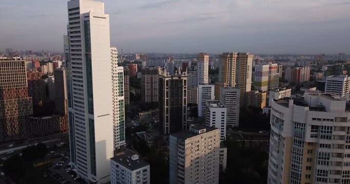 4K late afternoon summer aerial video of newly built modern highrise Moscow apartment buildings block complex in Kuntsevo district near Molodeznaya subway station and Rublevskoye highway in Russia