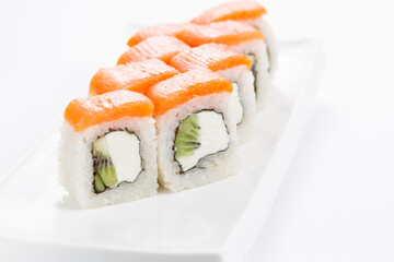 Japanese food, tasty of meal for lunch. Seafood. Philadelphia roll, salmon, soft cheese and kiwi