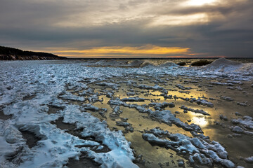 Winter landscape with a river covered with snow and ice hummocks. Ob River, Western Siberia