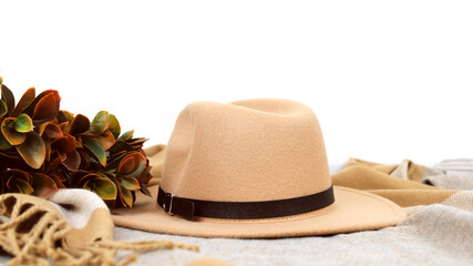 Beige hat among autumn things. Autumn accessories isolated on white background.