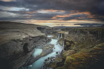 Wandaufkleber Beautiful sunset and landscape of Sigoldugljufur canyon with many small waterfalls and the blue river in Highlands of Iceland © Johannes