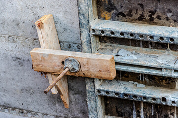 Reinforced concrete foundation of a modern monolithic residential building. Prepared formwork with reinforcing mesh for pouring concrete. Monolithic construction technologies.