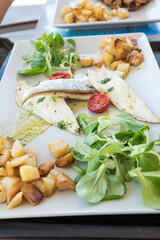 Grilled sea bream fillet with potatoes