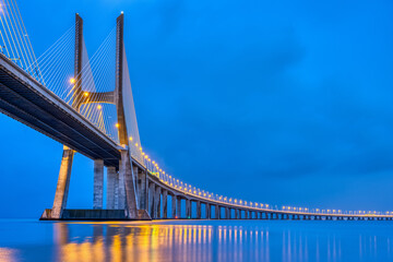 The Vasca da Gama bridge across the river Tagus in Lisbon, Portugal, at dusk