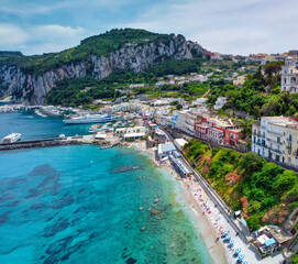 Fototapeta premium Panoramic aerial view of Capri Port Beach in Capri from drone.