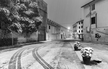 PISA, ITALY - MARCH 1, 2018: Street of Pisa with snow on a winter morning. Last snowfall had been...