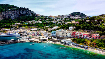 Fototapeta na wymiar Beautiful coastline of Capri along the port area. Aerial view from drone.