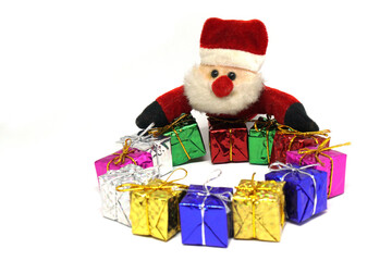 Santa claus doll and Many presents gift box - Xmas or Christmas  concept on white background