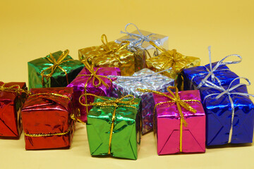 Many Gift Box arrange flat patterns - Xmas or Christmas  concept on yellow pastel background and copy space  