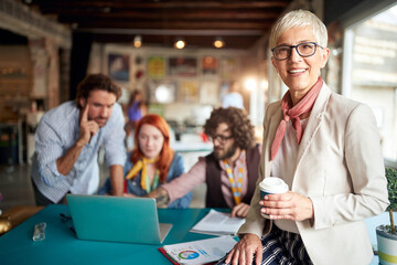 Group of young coworkers consulting