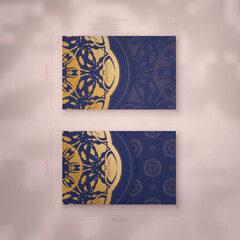 Business card in dark blue with vintage gold ornaments for your brand.