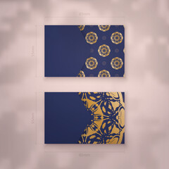 Business card in dark blue with vintage gold ornaments for your personality.