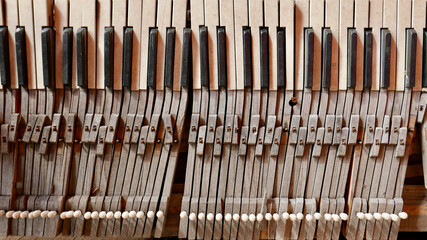 close up of old derelict piano keys,