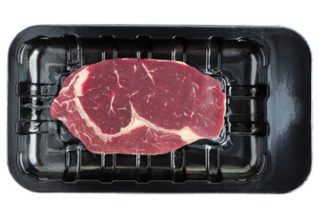 Fresh beef steak  in plastic tray on white background.
