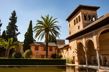Fototapeta premium The Ladies Tower (Torre de las Damas, also known as Partal Palace) in the Garden of the Partal (Jardines del Partal), Nasrid palaces, Alhambra de Granada, Andalusia, Spain