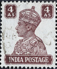 India - circa 1941 : a postage stamp from India showing the portrait of King George VI wearing...