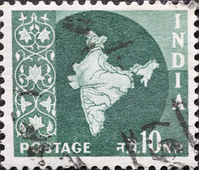 India - circa 1957: a postage stamp from India showing the silhouette of the map of India decorated...