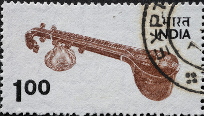 India - circa 1975: a postage stamp from India showing a Veena string instrument