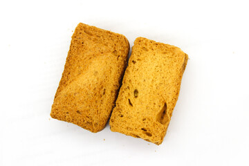Crispy rusk on white background with selective focus