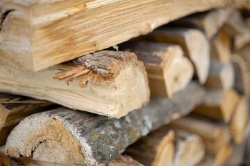 .Background of dry chopped firewood logs in a pile