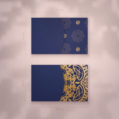Presentable business card in dark blue with abstract gold ornaments for your contacts.