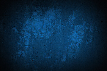 Abstract grunge dark navy background, textured. Dark navy textured wall, dark edges. Concrete wall background.