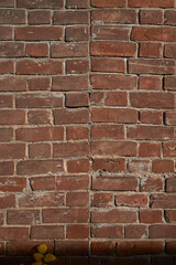    Old brick wall, old texture of red stone blocks closeup        