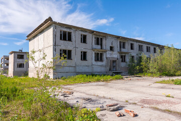Fototapeta na wymiar Two-story abandoned houses in the ghost town of Rudnik, Vorkuta, Russia