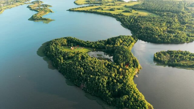 Lyepyel District, Vitebsk Region, Belarus. Aerial View Of Residential Area With Houses In Countryside. Morning Fog Above Lepel Lake And Town Skyline