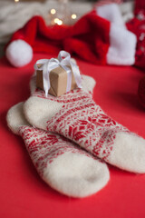 christmas stocking and gifts on red festive background