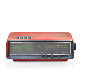 front view di cut old digital clock AM/FM radio on white background,copy space