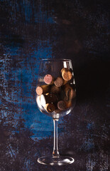 Still life of a wine glass full of corks. Concept for wine cellars