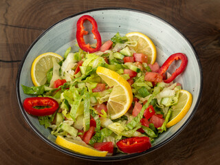 salad on white plate on wood
