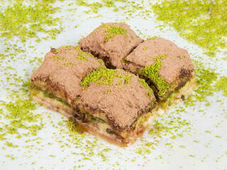 Turkish desert baklava with peanut, havuç dilim, midye, sarma, ramadan on the white plate turkish tasty