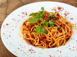 italian pasta white plate wood background