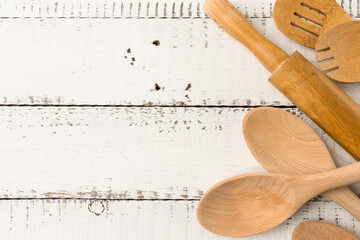 Trendy kitchen wooden spoons. Minimal trendy banner with a bunch of wooden tools. Cooking background. Ecological concept. Modern trendy background. Copy space. Ready for use