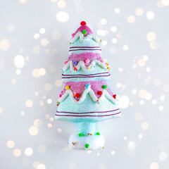 Christmas tree in pink blue bokeh colors. Christmas, winter, new year concept. Apartment lay, top view