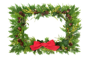 Christmas and winter solstice eco friendly natural nature background border with red bow, cedar...